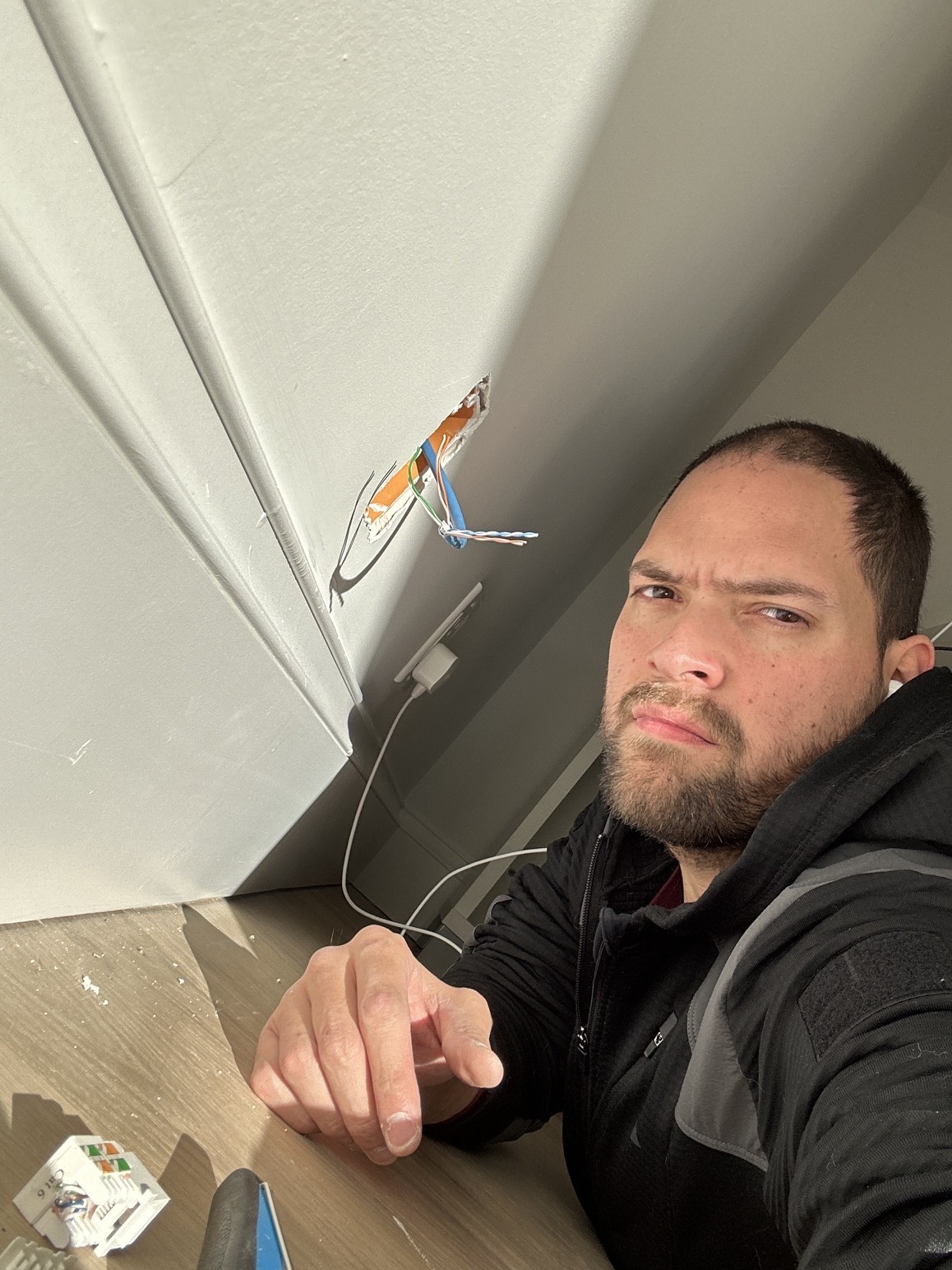 Jordan Sculnick running Cat6 cabling on site