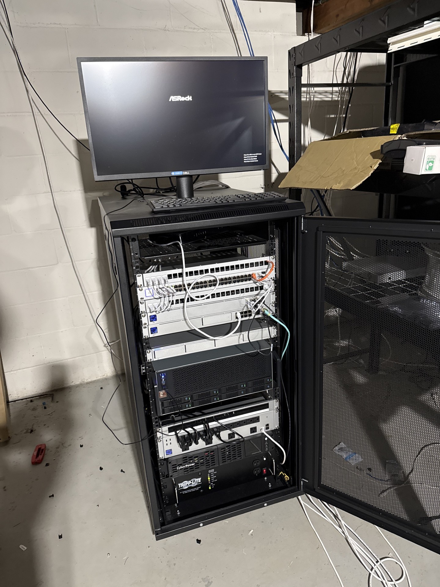 Network cabinet buildout in progress with UPS power protection